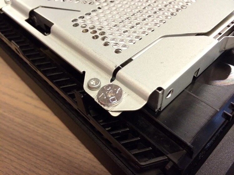 Remove the screw that secures the hard drive tray